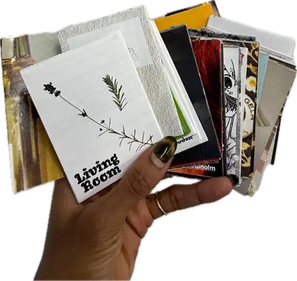 Hand holding unfolded Living Book edition 2